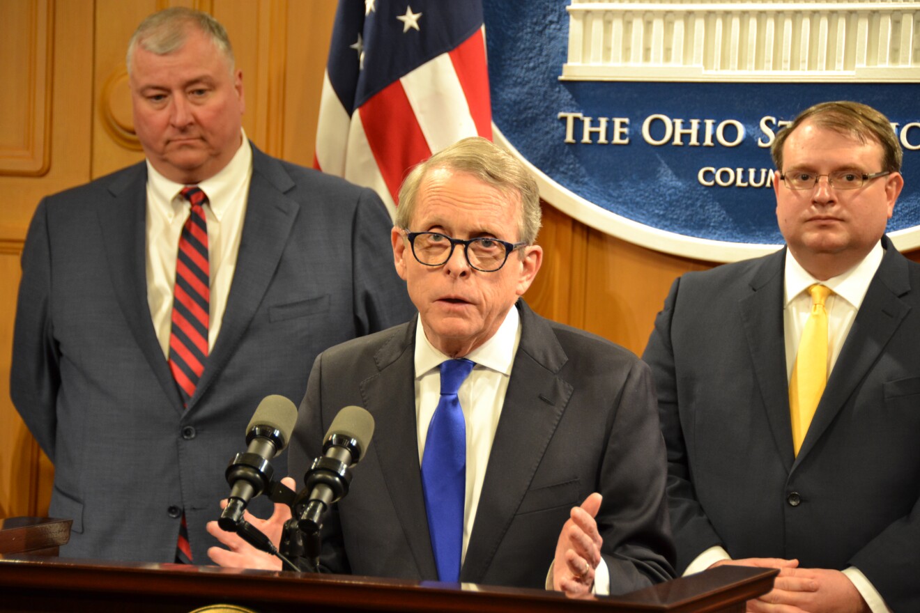 Speaker Larry Householder (R-Glenford), Gov. Mike DeWine, Senate President Larry Obhof (R-Medina) speak at a news conference in April 2019.